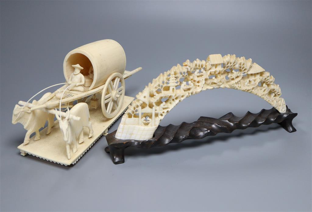 An early 20th century Indian ivory cart group and a Chinese boars tusk carving